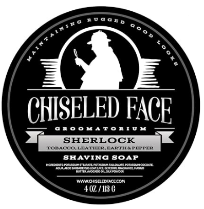 Sherlock Shaving Soap, showing a silhouette of Holmes in white on a black background and the words Chiseled Face Groomatorium Sherlock
            Tobacco, Leather, Earth and Pepper